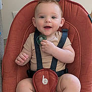 Nathan a rejoint le concours — aidez-le/la à gagner de superbes lots ! baby, infant, smile, pacifier, baby_seat, straps, mohawk, happy, child, cute, indoor, clothing, skin, person, seat, sitting, young, face, small_hand, expression