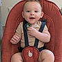 baby, infant, smile, pacifier, baby_seat, straps, mohawk, happy, child, cute, indoor, clothing, skin, person, seat, sitting, young, face, small_hand, expression