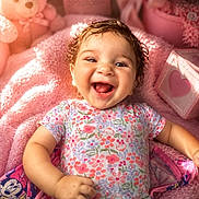 Raelynn joined the competition — help win amazing prizes! baby, smiling, infant, floral_clothing, pink_blanket, teddy_bear, soft_toys, cute, joyful, happy, child, portrait, indoors, cozy, colorful, cute_decor, baby_girl, close_up, playful, warm_lighting