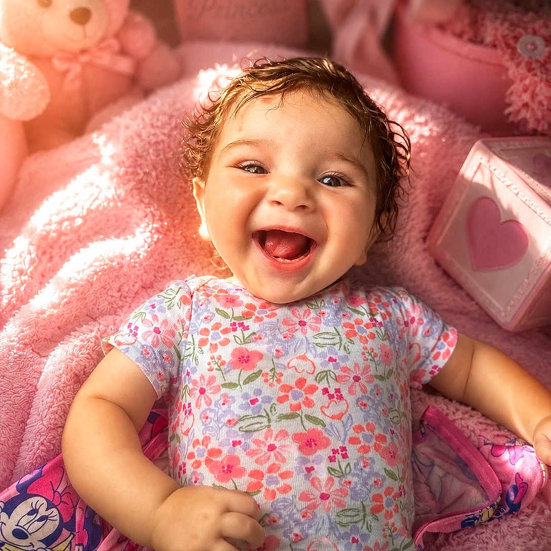 Raelynn joined the competition — help win amazing prizes! baby, smiling, infant, floral_clothing, pink_blanket, teddy_bear, soft_toys, cute, joyful, happy, child, portrait, indoors, cozy, colorful, cute_decor, baby_girl, close_up, playful, warm_lighting