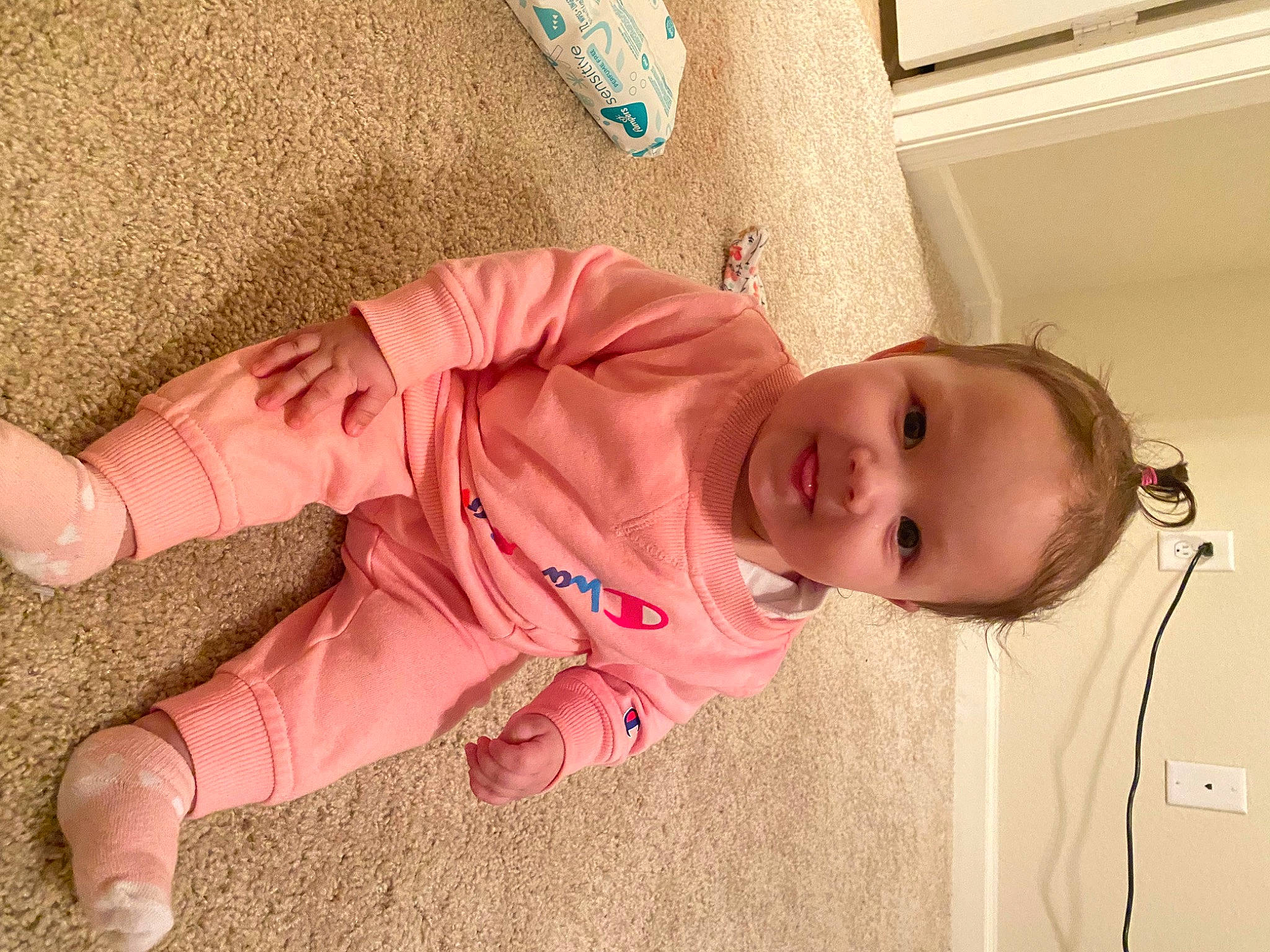 Blakelynn is registered to the contest to win money with this photo: baby, baby_products, baby_toddler_clothing, cheek, child, comfort, floor, flooring, foot, fun, human_leg, joy, linens, nose, person, pink, room, skin, sleeve, textile