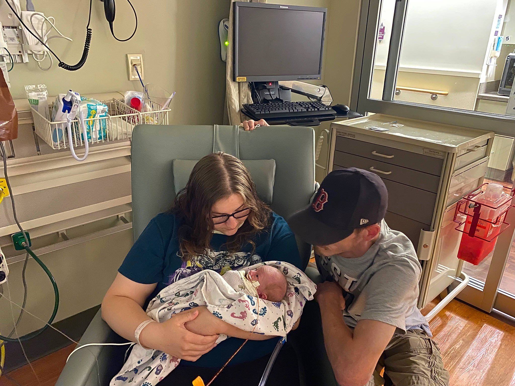 Jaxson is registered to the contest to win money with this photo: cabinetry, comfort, event, eyewear, health_care, health_care_provider, hospital, joint, machine, medical, medical_assistant, medical_equipment, medical_procedure, patient, person, room, service, t_shirt, television, television_set