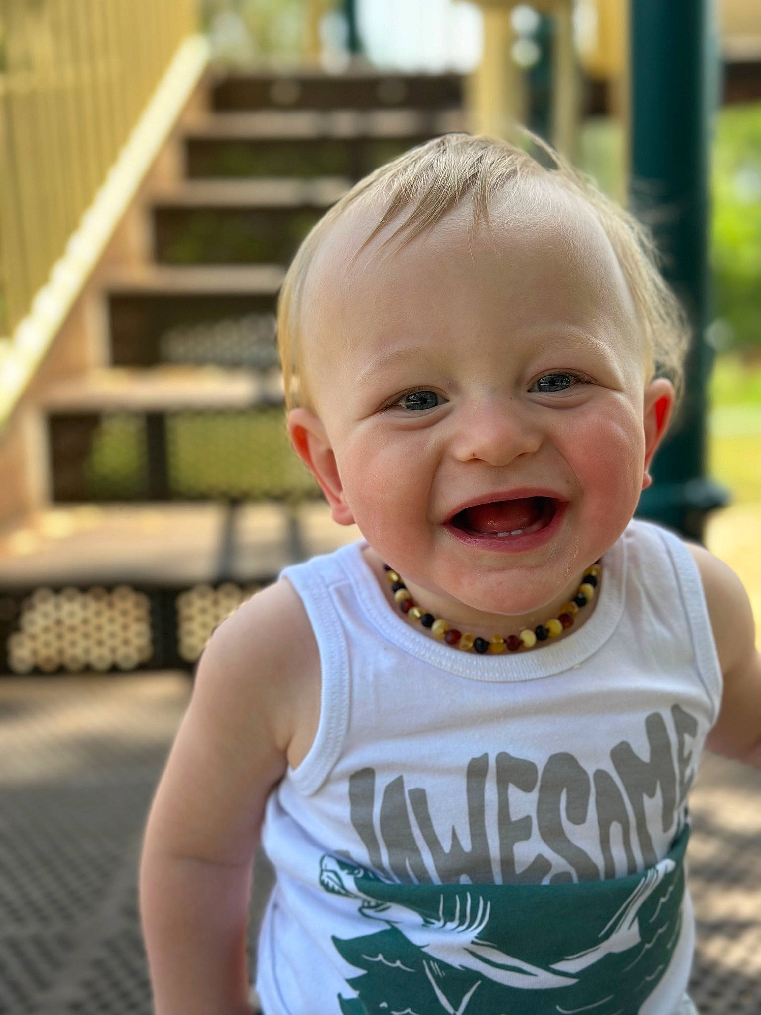Jaxson is registered to the contest to win money with this photo: active_tank, baby, baby_toddler_clothing, cheek, chin, eye, facial_expression, grass, hair, hairstyle, happy, human_body, iris, joy, lip, mammal, nose, person, skin, sleeve