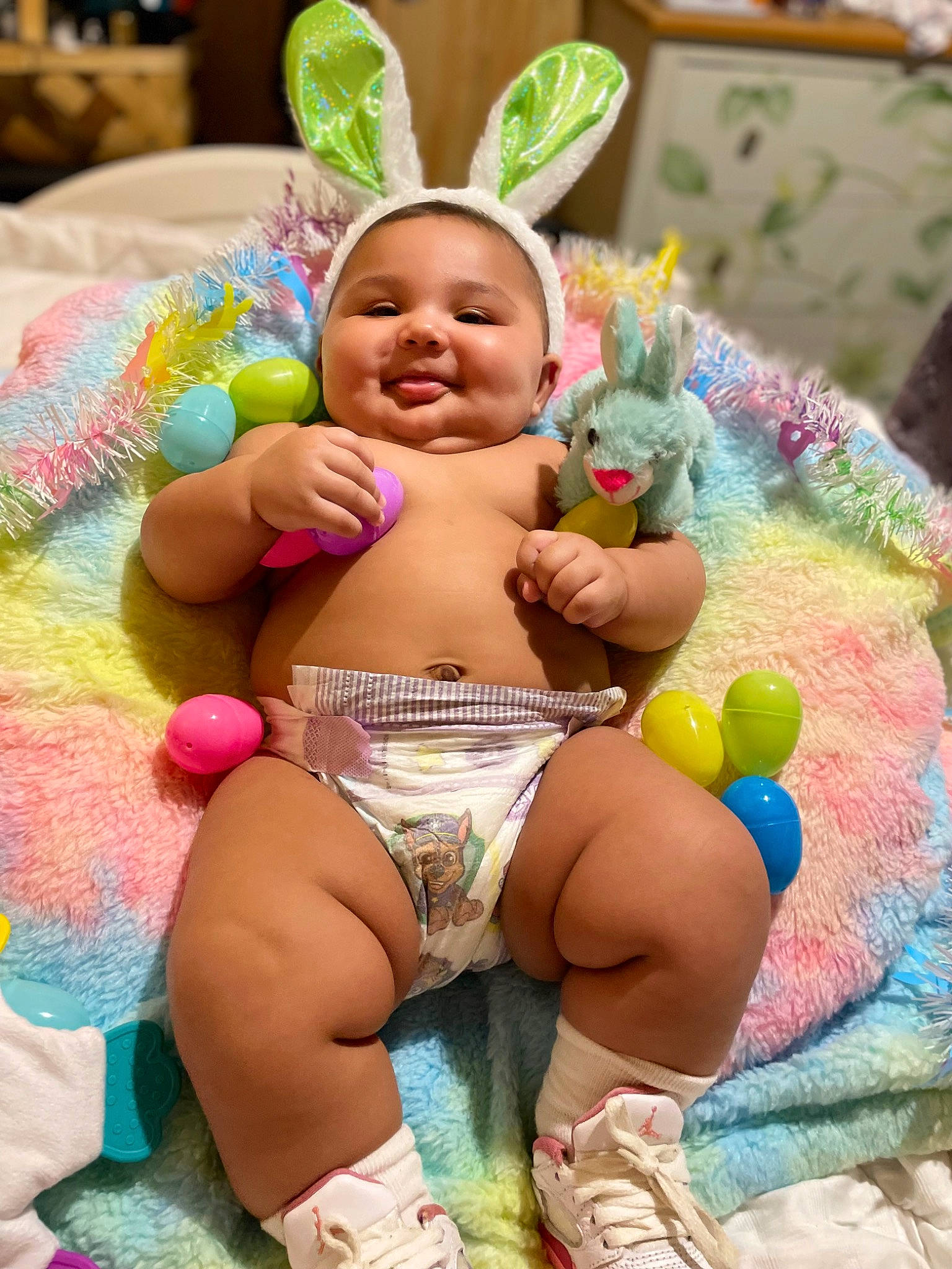 Amora is registered to the contest to win money with this photo: abdomen, baby, chest, child, event, finger, fun, happy, hat, human_leg, joy, leisure, party_supply, person, pink, play, sitting, skin, smile, thigh