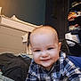 Alec participe au concours pour gagner de l'argent avec cette photo : baby, baby_boy, changing_table, child, closeup, clothing, crawling, face, folded_clothes, furniture, happy, head, home, indoor, person, plaid_shirt, portrait, room, shelf, smiling
