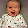 River-Bleu is registered to the contest to win money with this photo: baby, smiling, infant, onesie, clothing, face, happy, cute, portrait, child, young, expression, indoor, person, sitting, head, hair, skin, closeup, joyful