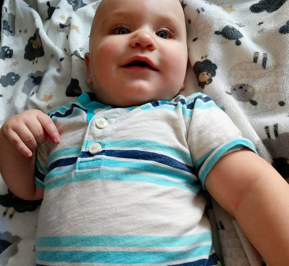 Cassius joined the competition — help win amazing prizes! baby, baby_toddler_clothing, blue, cheek, child, comfort, face, gesture, happy, iris, linens, nose, person, photograph, pink, skin, sleeve, smile, t_shirt, toddler