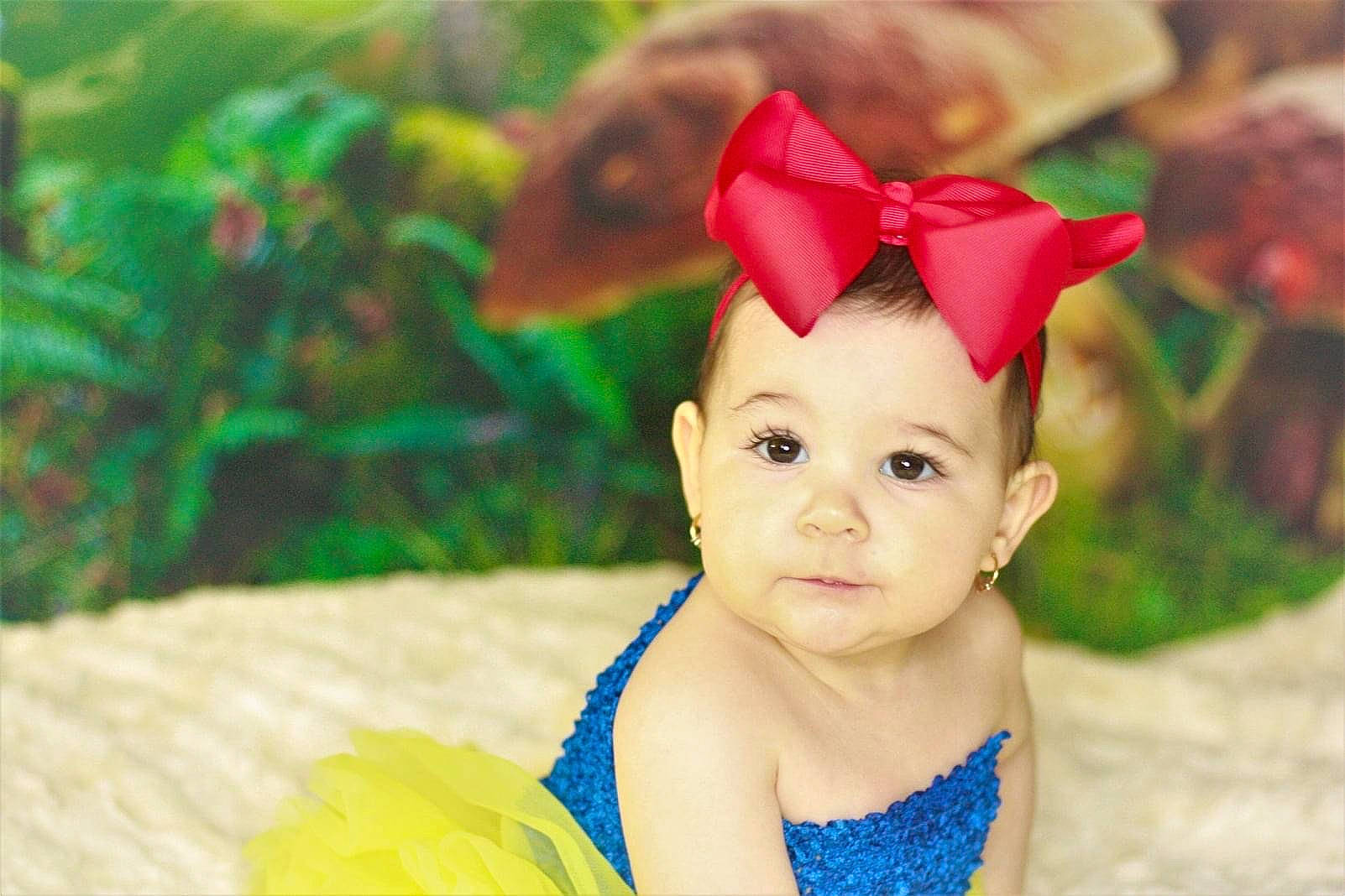 Alexa is registered to the contest to win money with this photo: baby, baby_toddler_clothing, cap, child, costume_hat, event, fashion_accessory, fawn, fun, grass, hair_accessory, happy, hat, headband, headgear, leisure, party_hat, party_supply, person, recreation