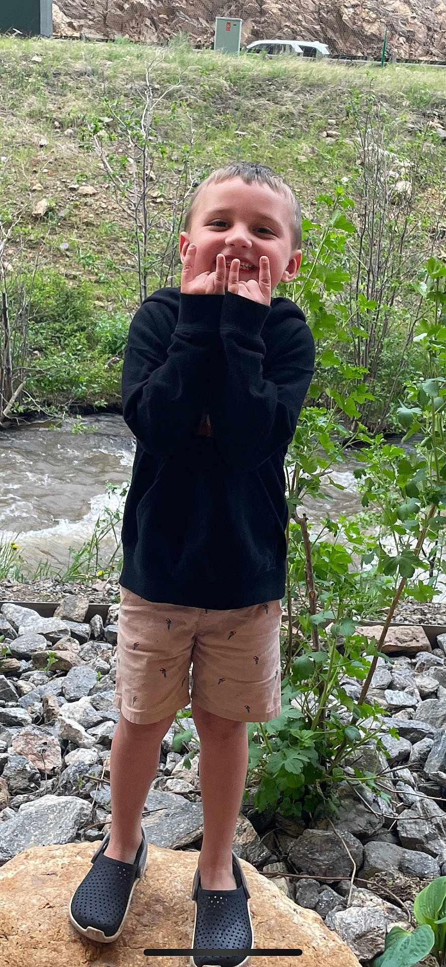 River joined the competition — help win amazing prizes! bodypart, boy, child, clothing, coat, face, finger, footwear, hand, head, male, pants, person, photography, portrait, rock, shoe, shorts, slate, soil