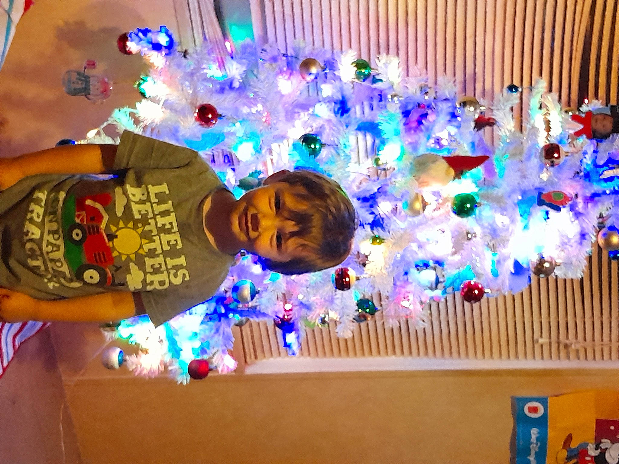 Savior Gosnell is registered to the contest to win money with this photo: balloon, blue, christmas, christmas_decoration, curtain, decoration, electric_blue, event, fun, happy, hat, holiday, joy, light, lighting, magenta, party_supply, person, purple, smile