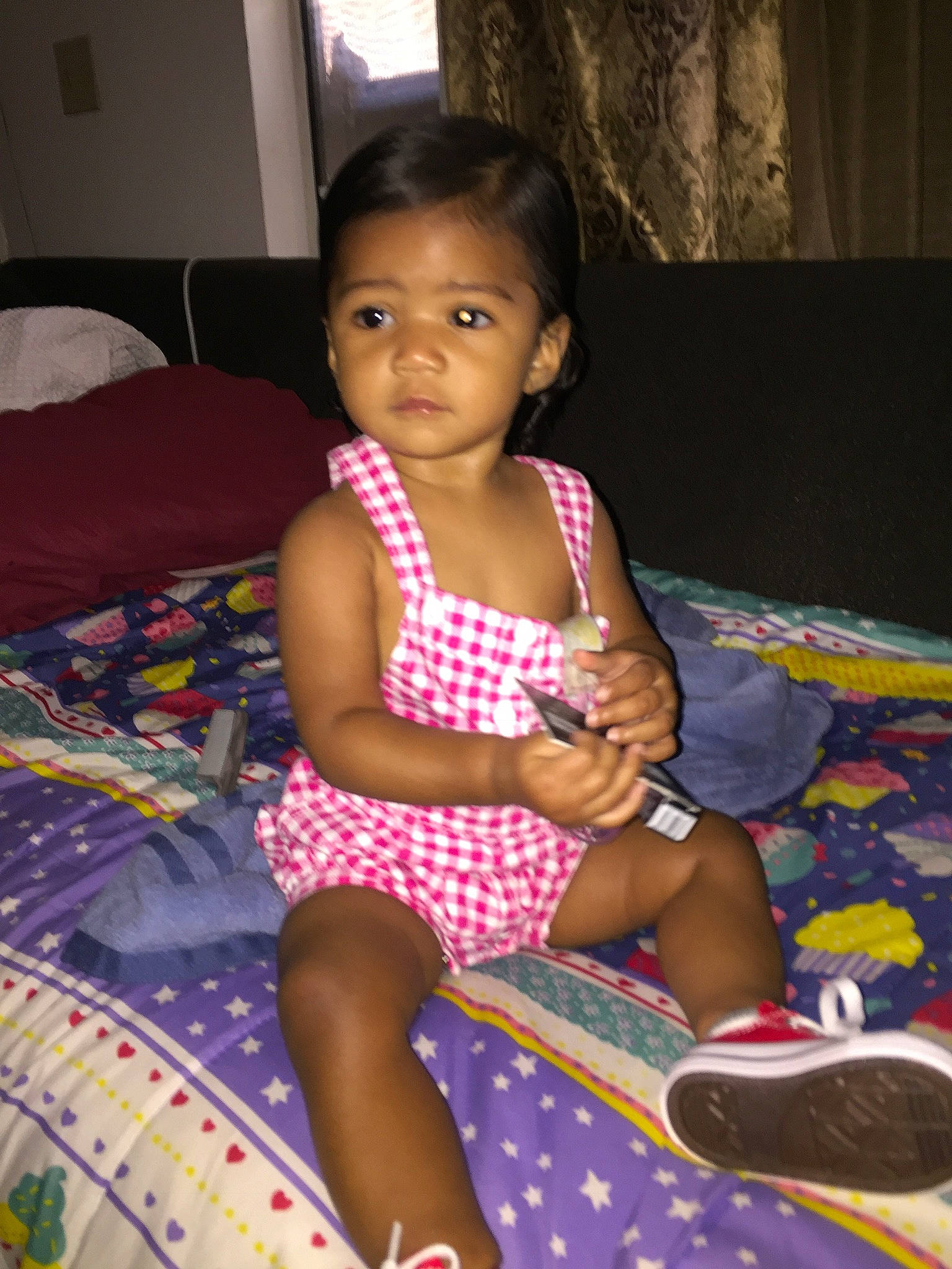 Gisselle is registered to the contest to win money with this photo: adaptation, baby, black_hair, cheek, child, leg, pattern, person, sitting, skin, smile, thigh, toddler, vacation