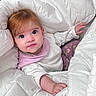 Luísa is registered to the contest to win money with this photo: baby, infant, blanket, white_blanket, pink_bib, patterned_pants, cute, face, child, young, cozy, soft, indoor, portrait, laying_down, looking_up, expression, small_hand, comfort, warm