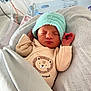 Aaron participe au concours pour gagner de l'argent avec cette photo : newborn, baby, sleeping, hat, knitted, blanket, hospital, onesie, lion_print, infant, cute, peaceful, wrapped, child, soft, portrait, cozy, nursery, resting, small