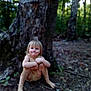 Layla is registered to the contest to win money with this photo: child, forest, tree, dirt, nature, outdoor, barefoot, blonde_hair, squatting, young_child, casual_clothing, smiling, sunlight, greenery, ground, playful, person, daylight, woods, adventure