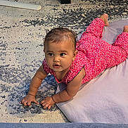 Olivia joined the competition — help win amazing prizes! baby, bright_colors, carpet, child, crawling, curious, cushion, cute, feet, floor, hair, hands, home, indoors, infant, patterned_rug, person, pink_clothing, portrait, young_child