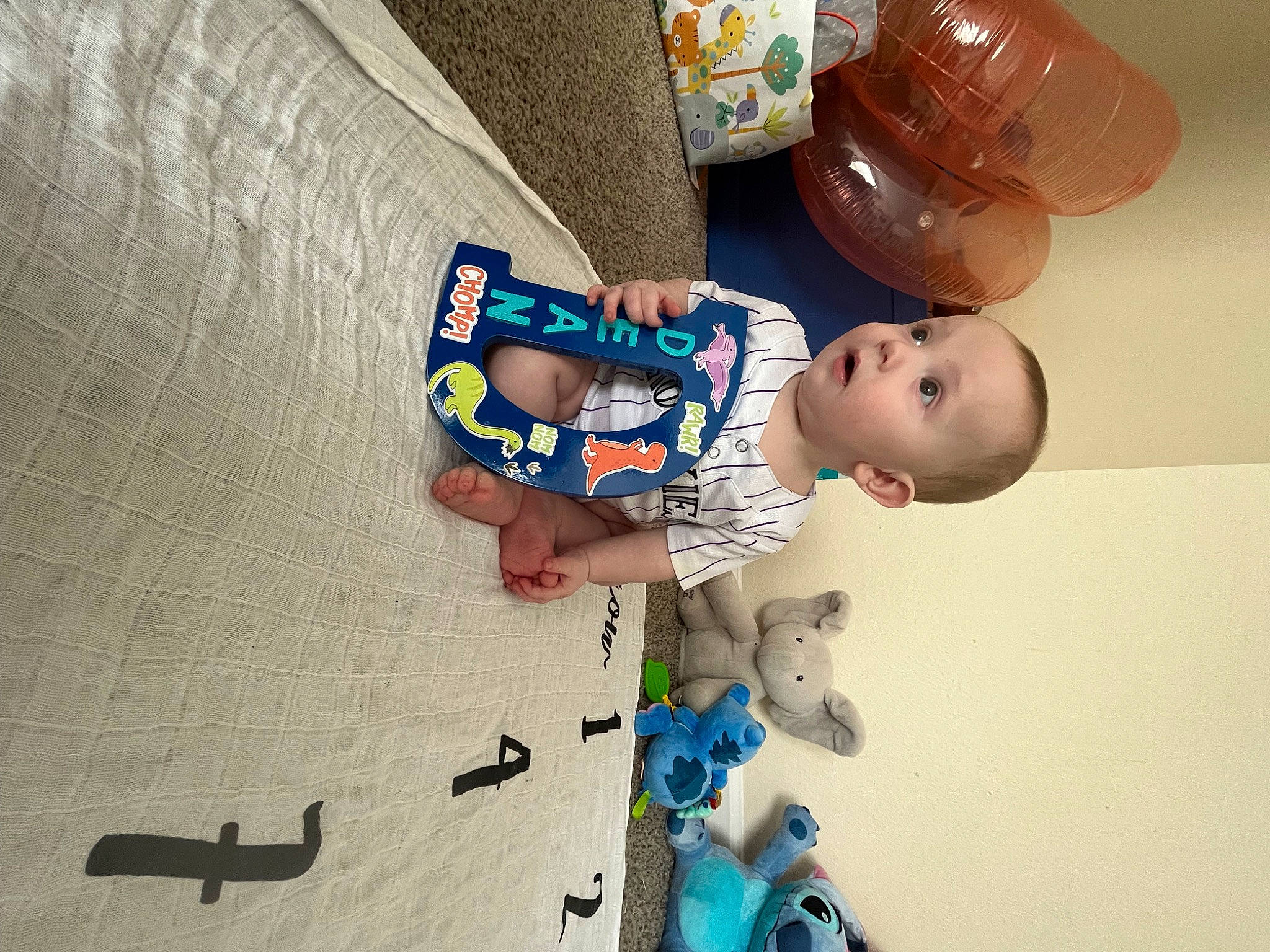 Dean joined the competition — help win amazing prizes! baby, baby_products, baby_toddler_clothing, blue, child, comfort, elbow, electric_blue, finger, flooring, fun, happy, person, play, room, sleeve, surprise, t_shirt, tableware, toddler