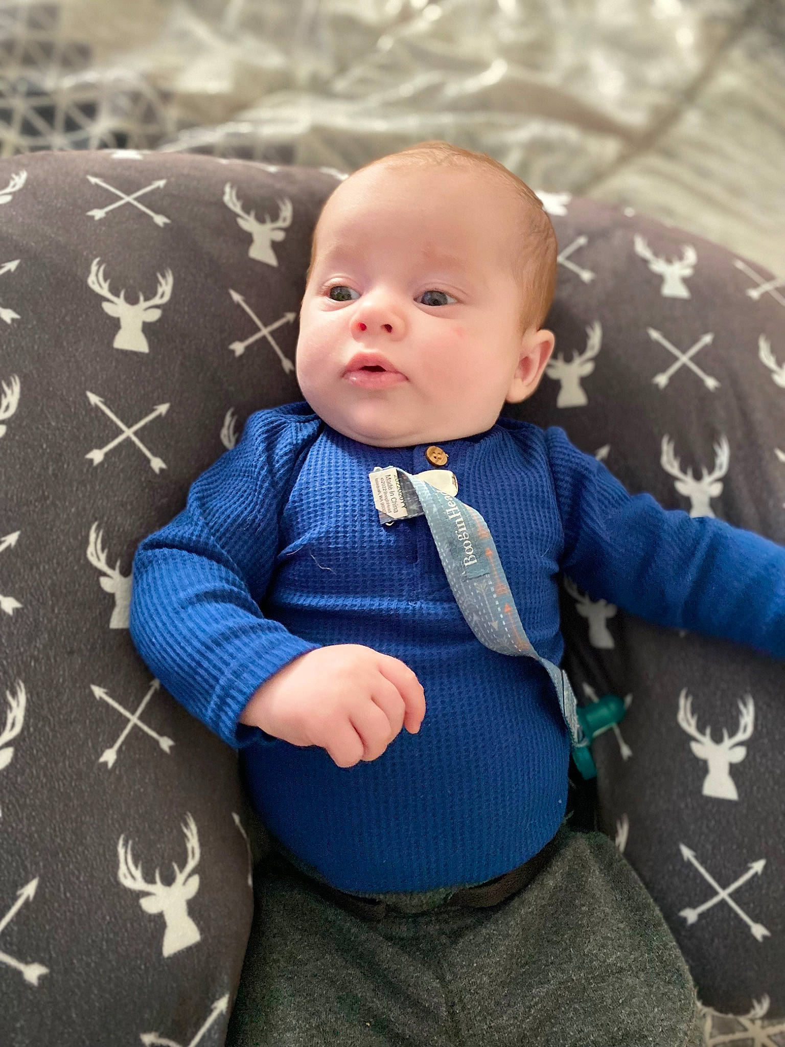 Liam joined the competition — help win amazing prizes! baby, baby_toddler_clothing, child, collar, comfort, electric_blue, face, grey, hairstyle, head, linens, pattern, person, sitting, skin, sleeve, suit, t_shirt, textile, toddler