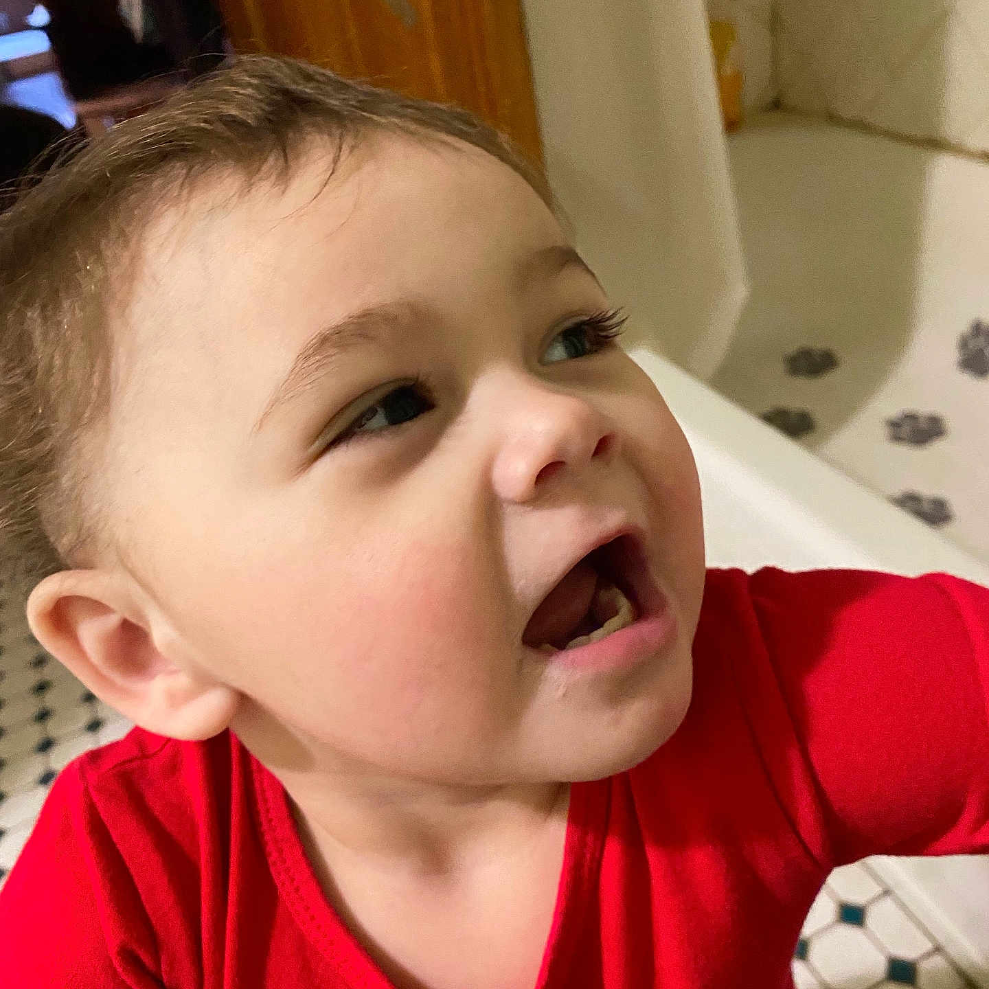 Autumn is registered to the contest to win money with this photo: bathroom, bathtub, casual, child, closeup, cute, expression, face, hair, home, indoor, looking_away, mouth_open, person, portrait, red_shirt, skin, tile_floor, toddler, young_child