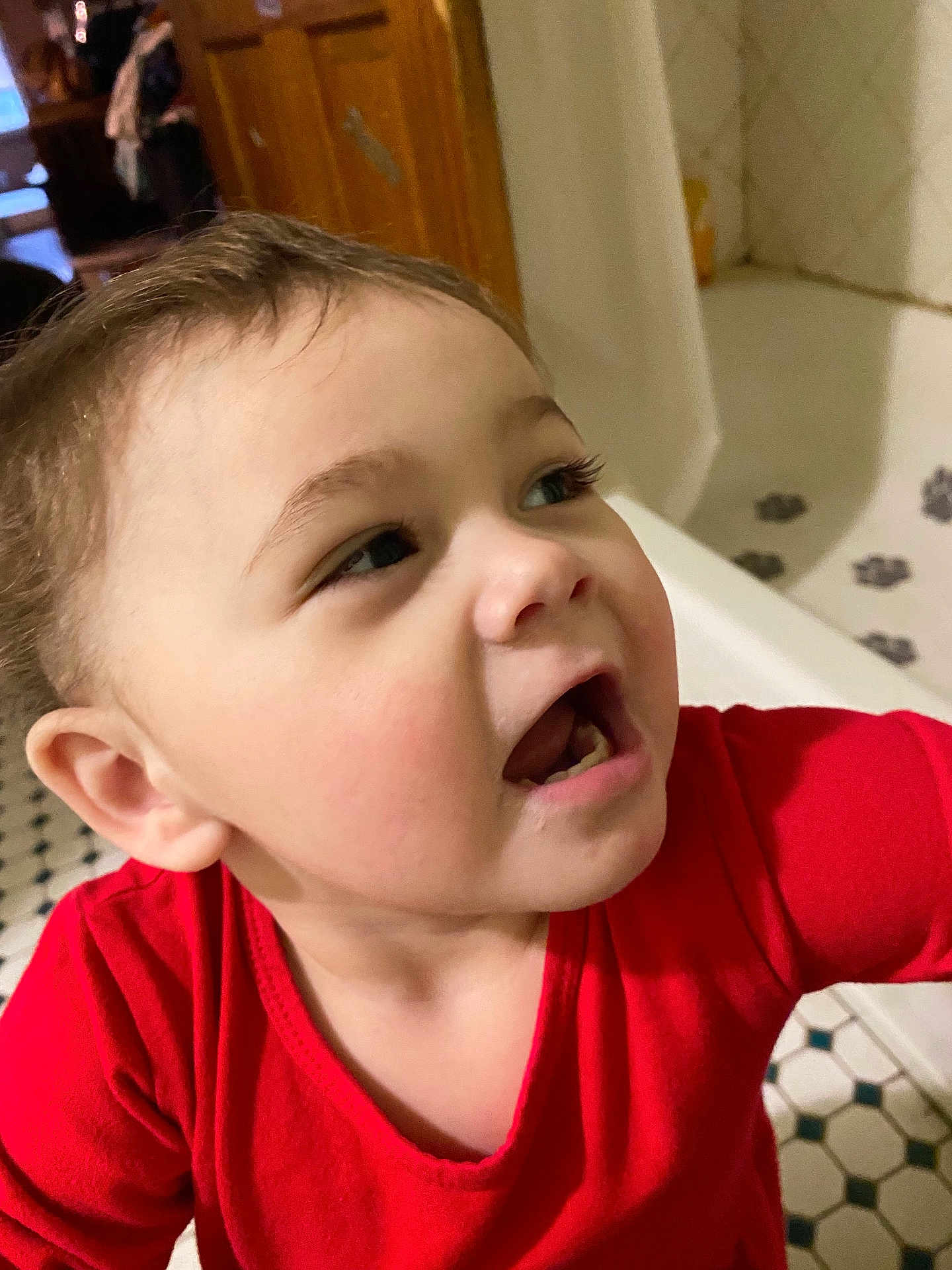 Autumn is registered to the contest to win money with this photo: toddler, child, face, expression, red_shirt, indoor, bathroom, bathtub, tile_floor, person, cute, young_child, skin, hair, mouth_open, looking_away, closeup, home, casual, portrait