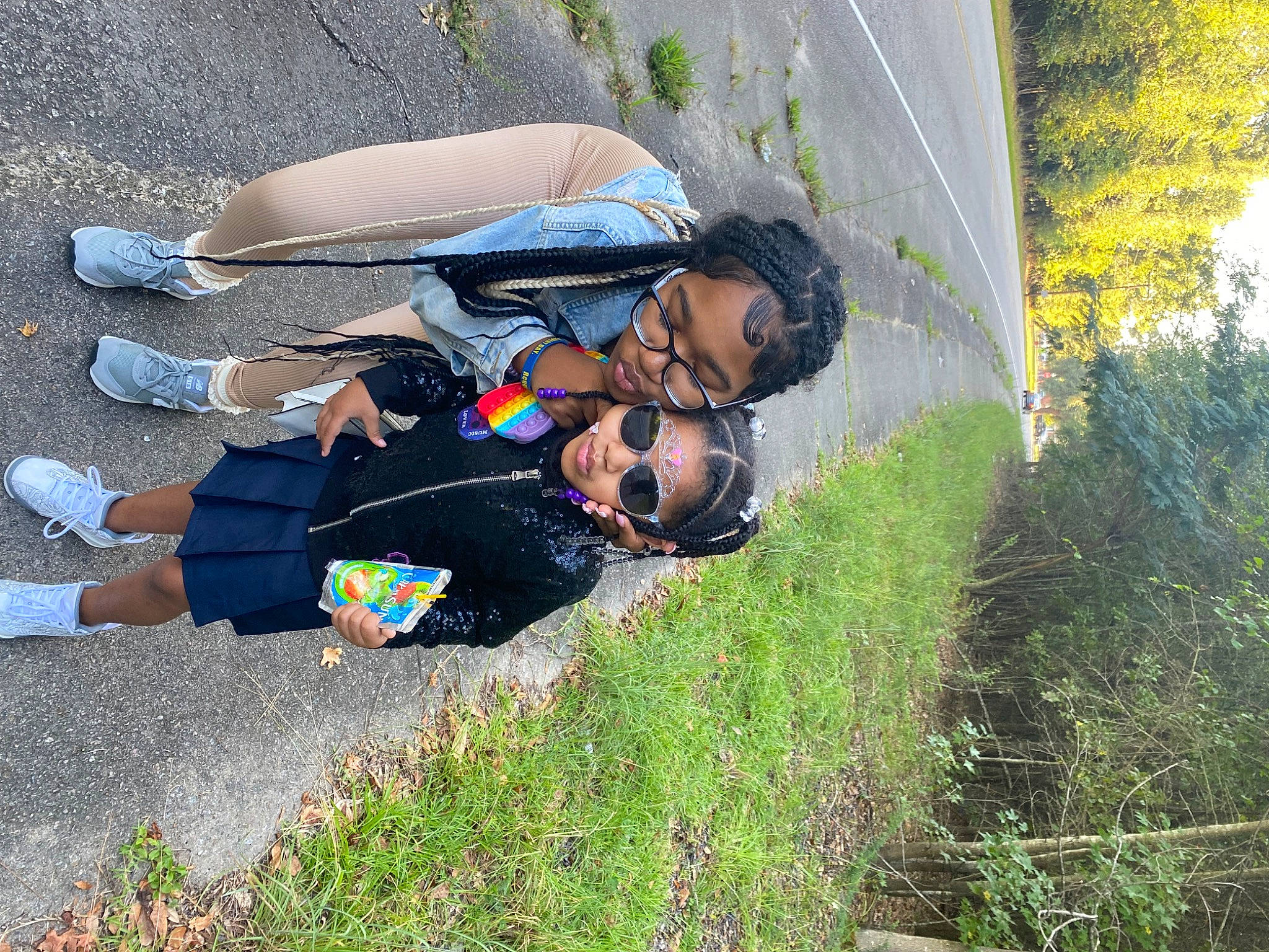 Summerlyn is registered to the contest to win money with this photo: adventure, eyewear, footwear, fun, grass, grassland, happy, landscape, leg, leisure, people_in_nature, person, personal_protective_equipment, plant, recreation, shoe, sneakers, sports, sunglasses, toddler