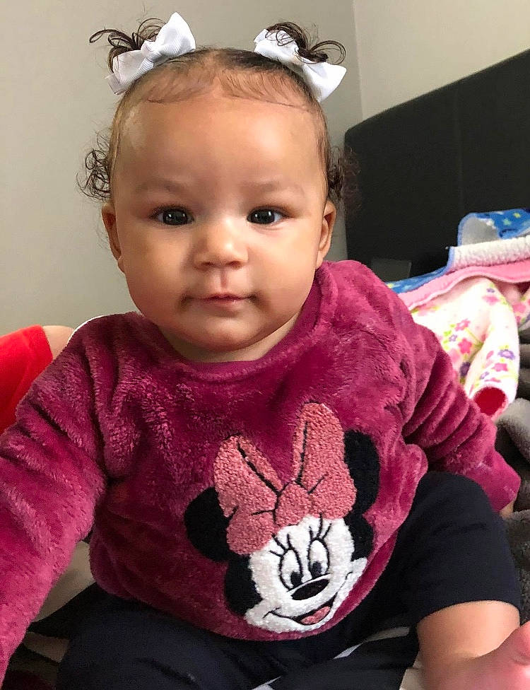 Kaia is registered to the contest to win money with this photo: baby, baby_toddler_clothing, cheek, child, chin, cool, ear, eyelash, face, hairstyle, head, headpiece, lip, magenta, neck, person, pink, skin, sleeve, t_shirt