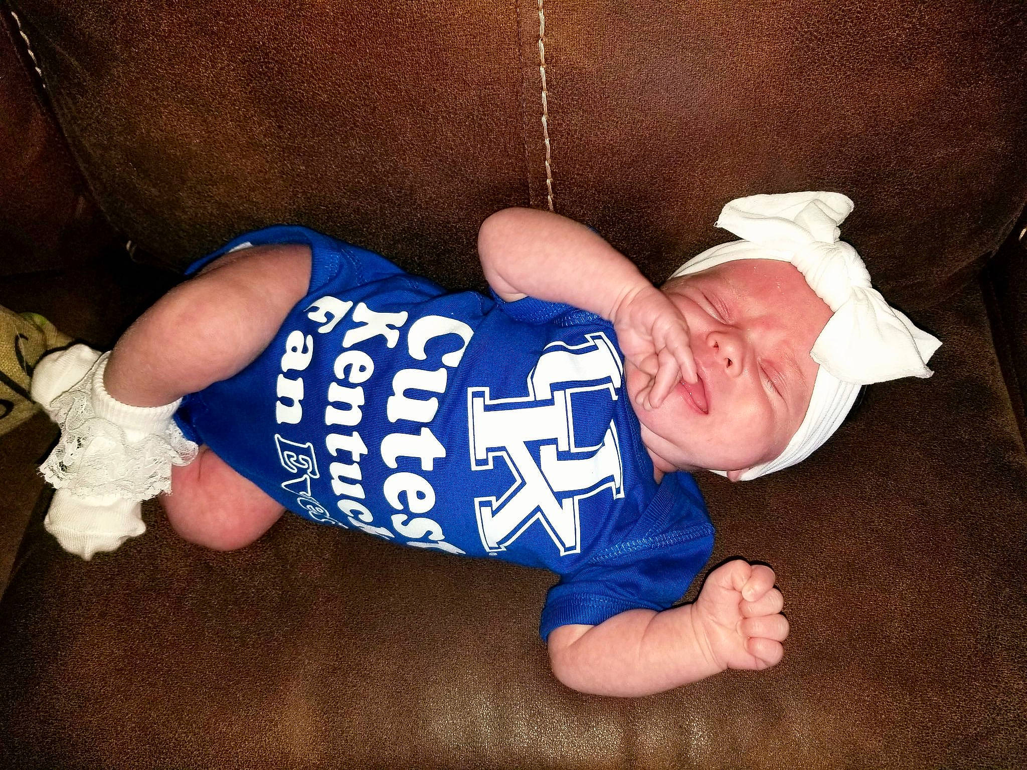 Brittany Luray is registered to the contest to win money with this photo: arm, baby, baby_sleeping, baby_toddler_clothing, child, elbow, electric_blue, eye, finger, hat, human_body, knee, leg, nail, person, sleeve, sock, t_shirt, thigh, thumb