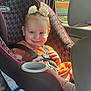 Trinity joined the competition — help win amazing prizes! toddler, child, car_seat, graco, safety_belt, flower_hair_clips, smile, sunlight, car_interior, window, orange_dress, seatbelt, baby, cute, infant, portrait, happy, sitting, hands, face