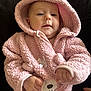 Trinity is registered to the contest to win money with this photo: baby, infant, pink, hood, cute, child, face, fuzzy_clothing, onesie, small_hands, portrait, warm, soft_texture, indoor, cozy, adorable, young, person, cuddly, expression