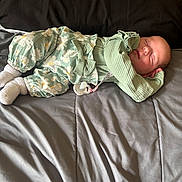 Trinity joined the competition — help win amazing prizes! baby, sleeping, infant, bed, blanket, clothing, pacifier, cute, cozy, child, rest, soft, floral, green, socks, comfort, peaceful, portrait, indoors, relaxation