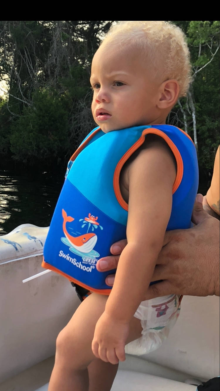 Ayven is registered to the contest to win money with this photo: child, lifejacket, person, toddler, vacation, water