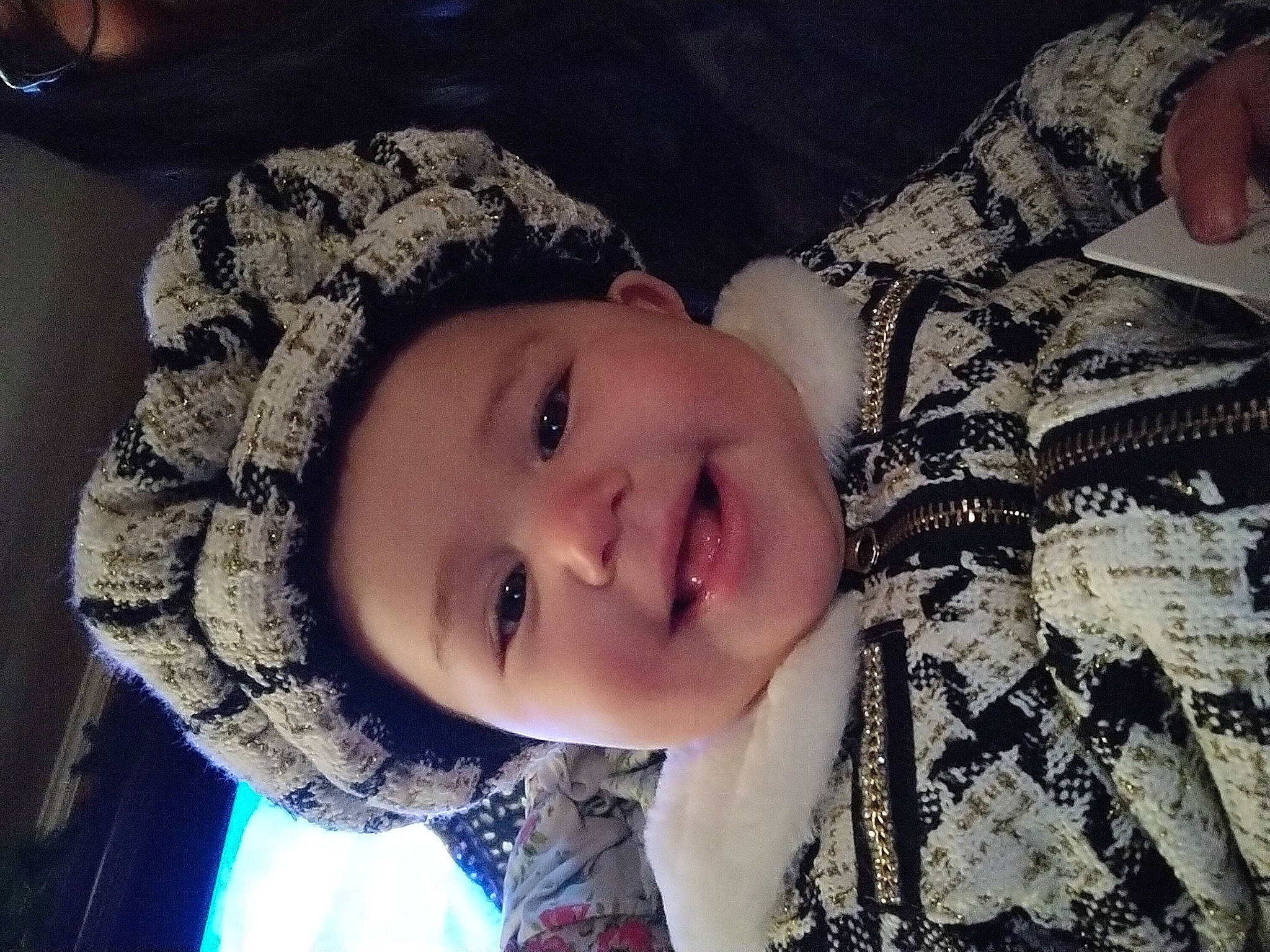 Sakura is registered to the contest to win money with this photo: black_hair, child, cloud, eyebrow, eyelash, flash_photography, freezing, grass, happy, headgear, headwear, human_body, jaw, knit_cap, lip, mouth, neck, person, plant, selfie