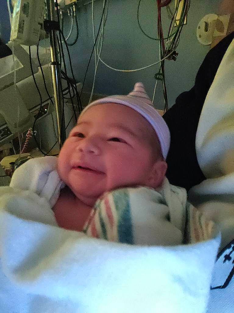 Sakura is registered to the contest to win money with this photo: baby, baby_safety, baby_sleeping, baby_toddler_clothing, cheek, child, comfort, event, fun, happy, hat, headwear, health_care, hospital, medical_equipment, mouth, person, room, service, skin