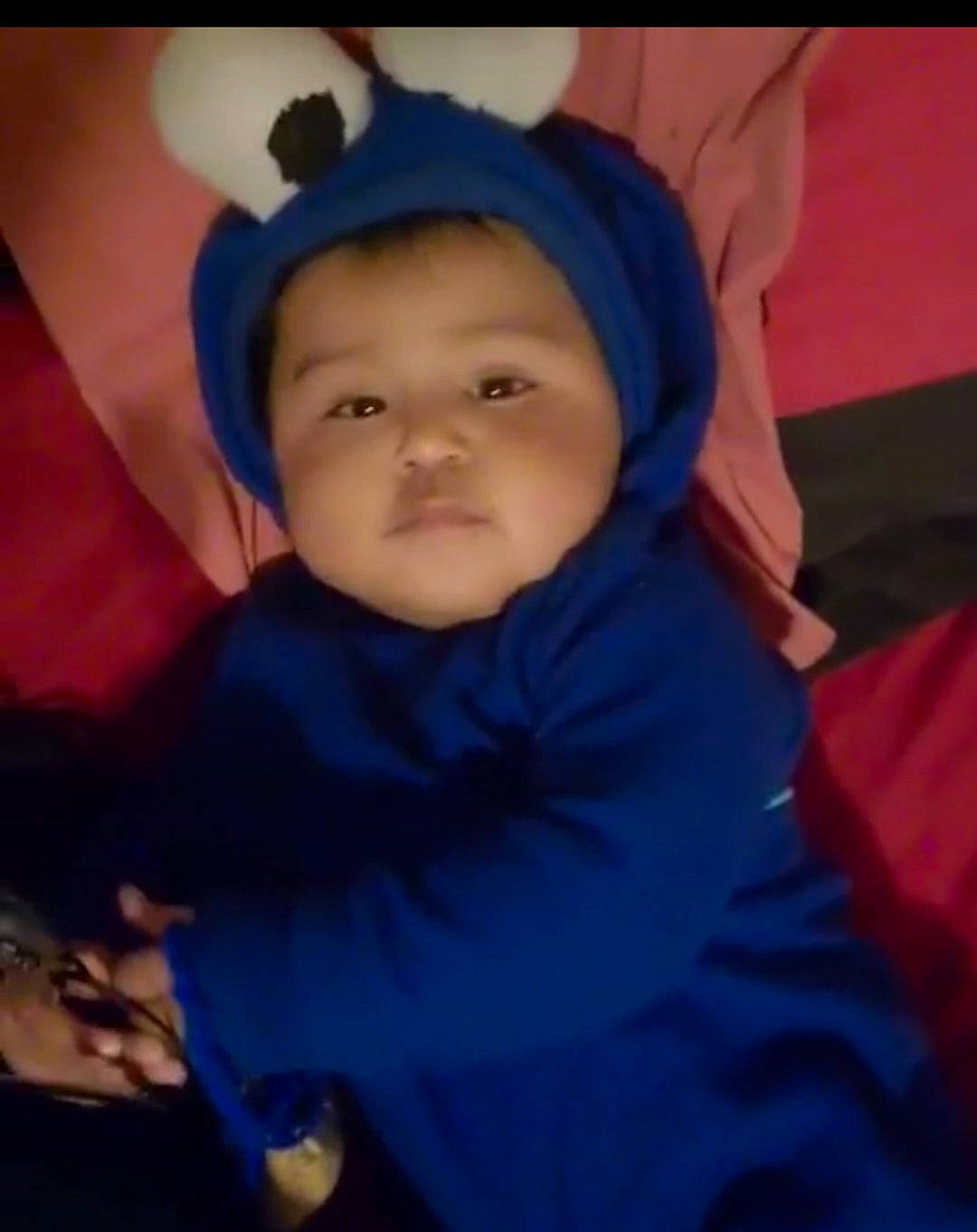 Orion is registered to the contest to win money with this photo: baby, blue, cheek, child, comfort, electric_blue, eye, eyebrow, flash_photography, fun, gesture, happy, headwear, iris, mouth, nose, person, purple, sitting, smile