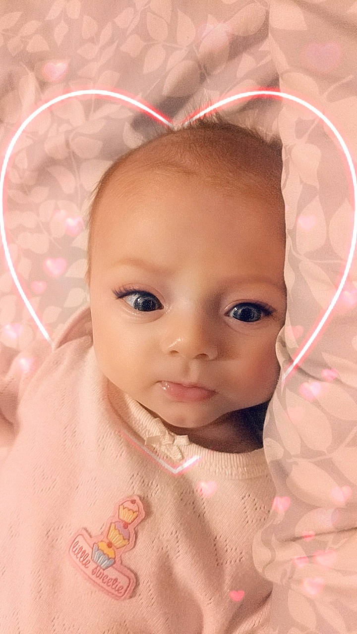 Annalee is registered to the contest to win money with this photo: baby, beauty, brown_hair, cheek, child, chin, close_up, ear, eye, eyebrow, eyelash, face, forehead, hair, head, lip, nose, person, pink, skin