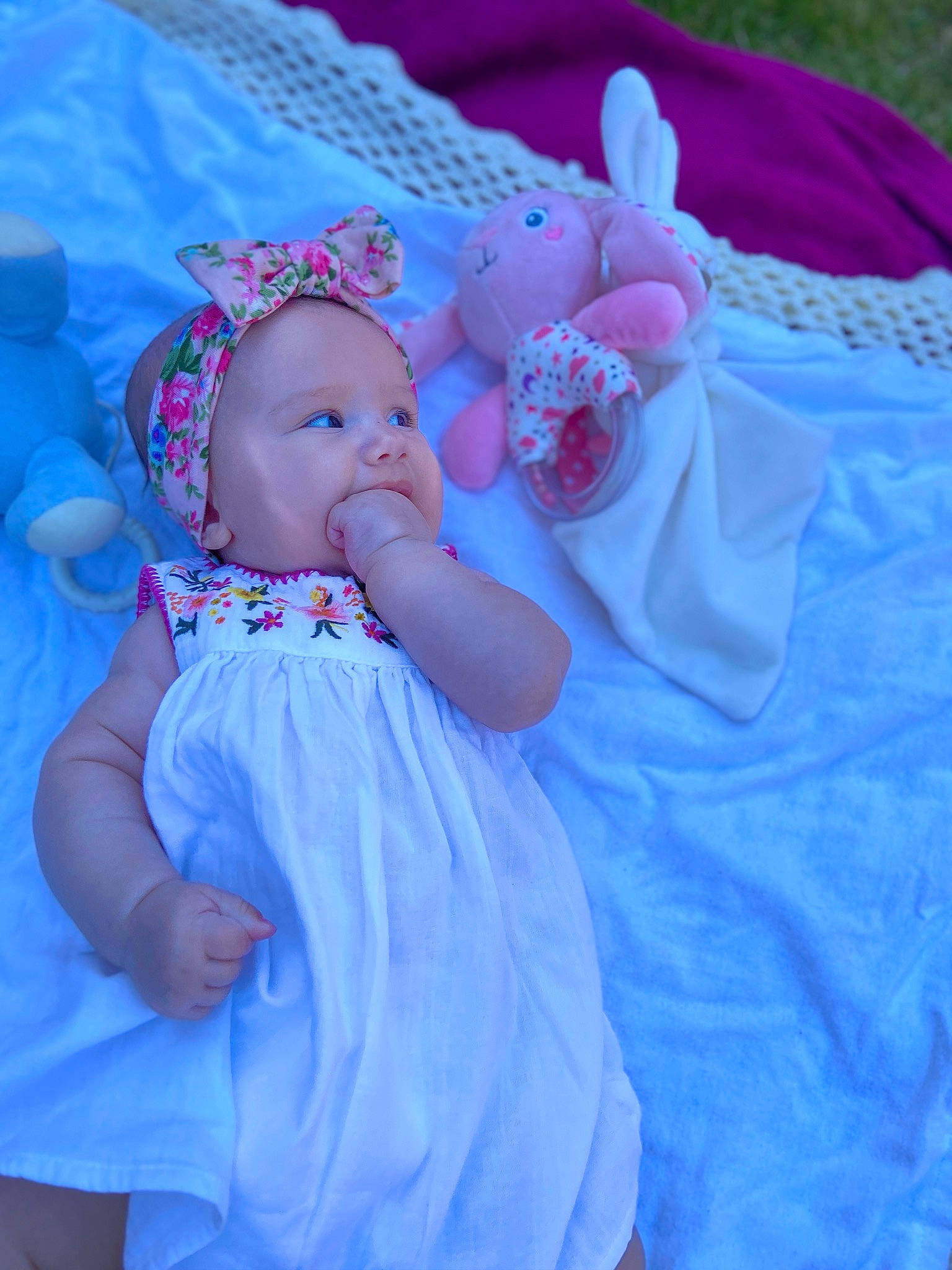 Emma joined the competition — help win amazing prizes! aqua, baby, baby_toddler_clothing, dress, electric_blue, finger, fun, hand, happy, hat, headwear, iris, magenta, person, petal, pink, plant, purple, skin, textile