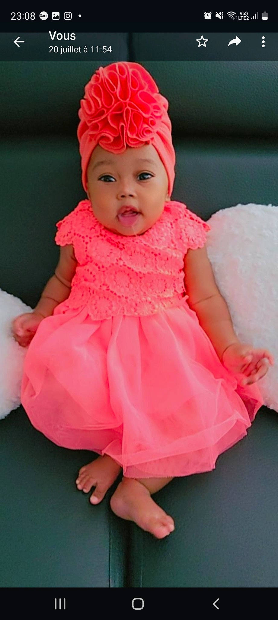 Allyson participe au concours pour gagner de l'argent avec cette photo : baby, baby_toddler_clothing, cap, cheek, child, dress, embellishment, face, facial_expression, finger, happy, headgear, headwear, magenta, outerwear, person, pink, red, skin, sleeve