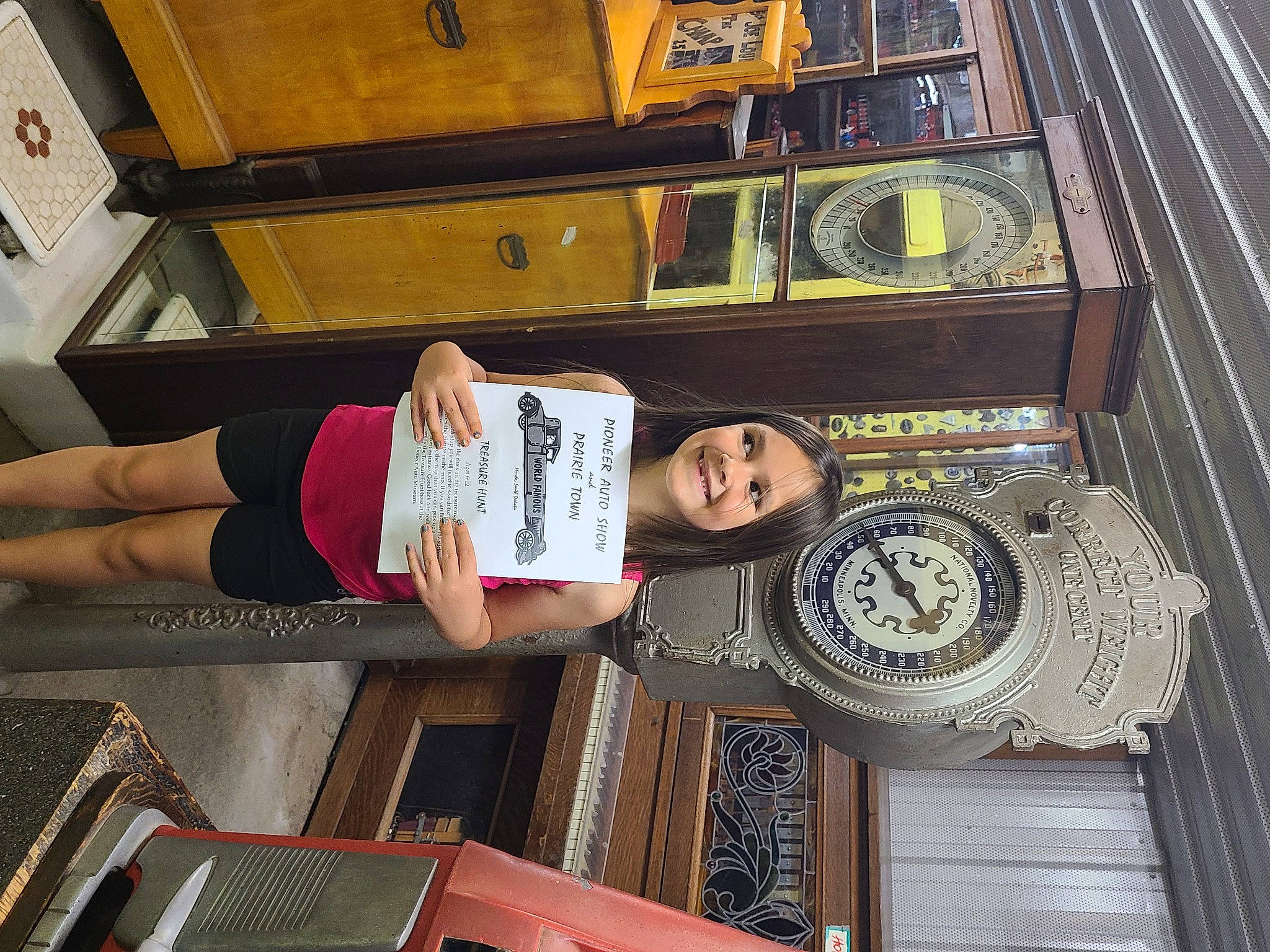 Skyla is registered to the contest to win money with this photo: building, hat, human_leg, joy, metal, person, room, shorts, snapshot, t_shirt, thigh, transport, waist, wood