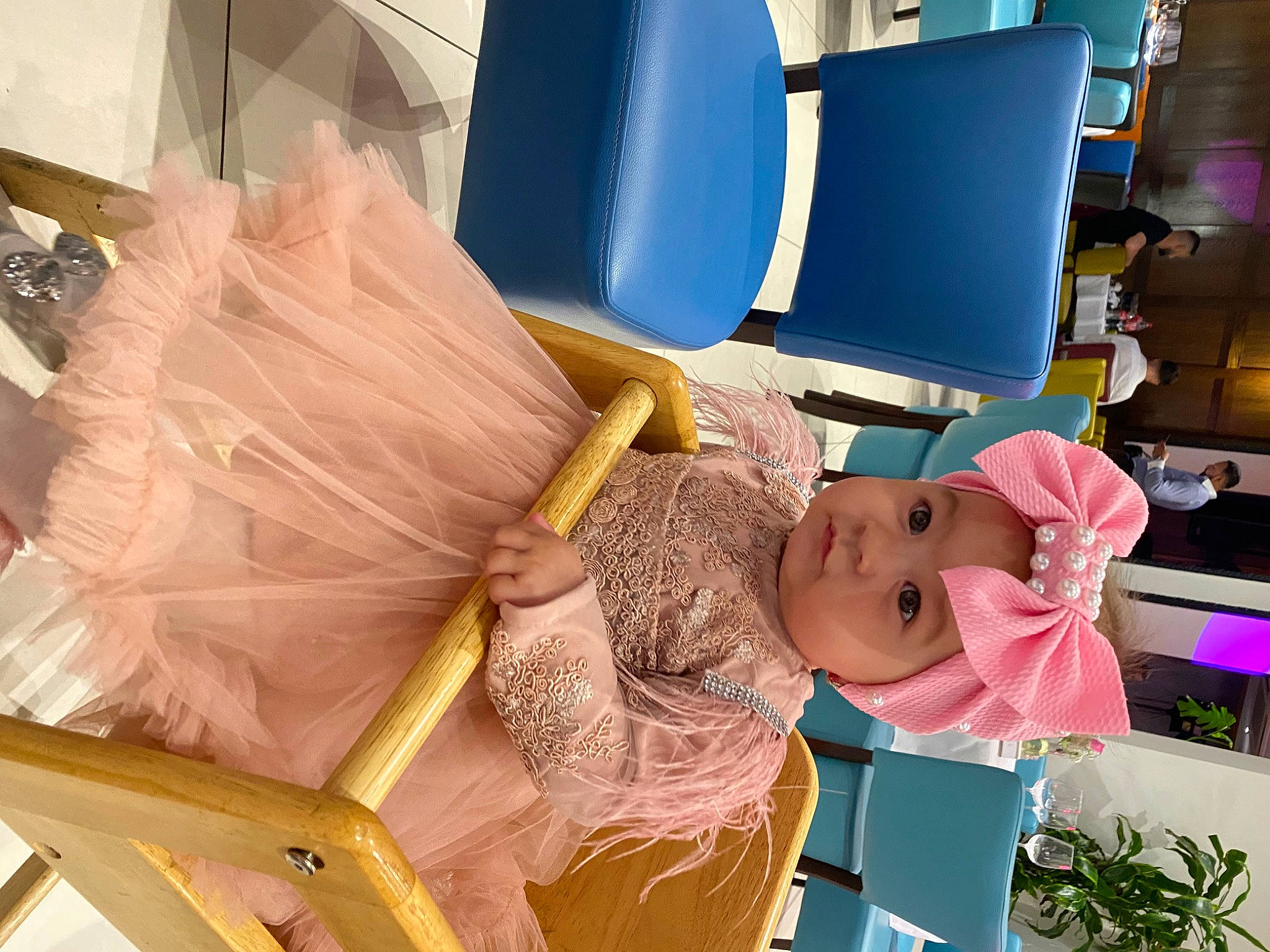 Selena is registered to the contest to win money with this photo: baby, baby_products, child, comfort, doll, event, fun, hat, headwear, leisure, person, plastic, plastic_bag, product, purple, room, service, textile, toddler, toy