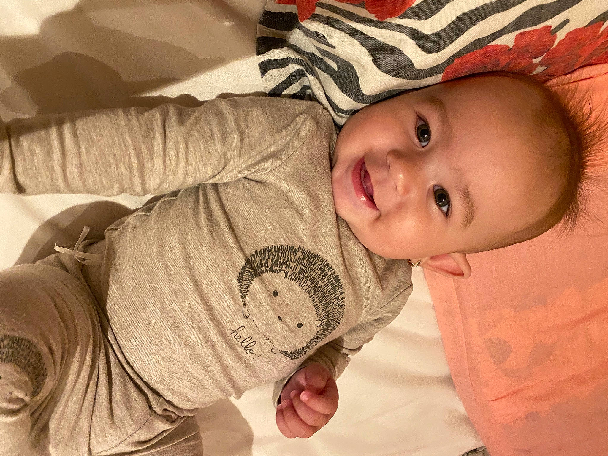 Selena is registered to the contest to win money with this photo: baby, baby_toddler_clothing, cheek, chin, cool, eye, eyebrow, face, facial_expression, happy, head, headgear, human_body, iris, joy, lip, mouth, nose, person, skin