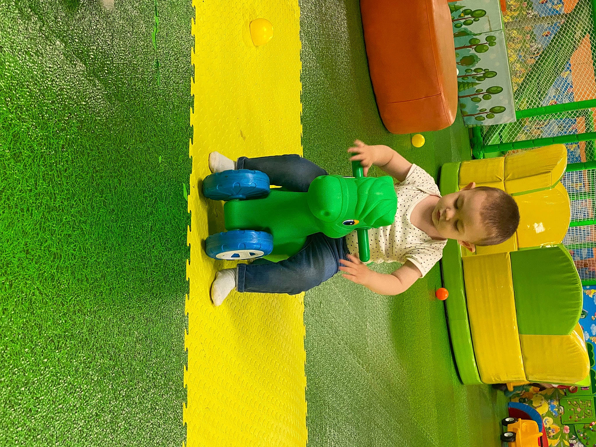 Damian is registered to the contest to win money with this photo: baby, baby_toddler_clothing, child, chute, city, electric_blue, fun, grass, green, leisure, outdoor_play_equipment, people_in_nature, person, plant, play, playground, recreation, t_shirt, toddler, yellow