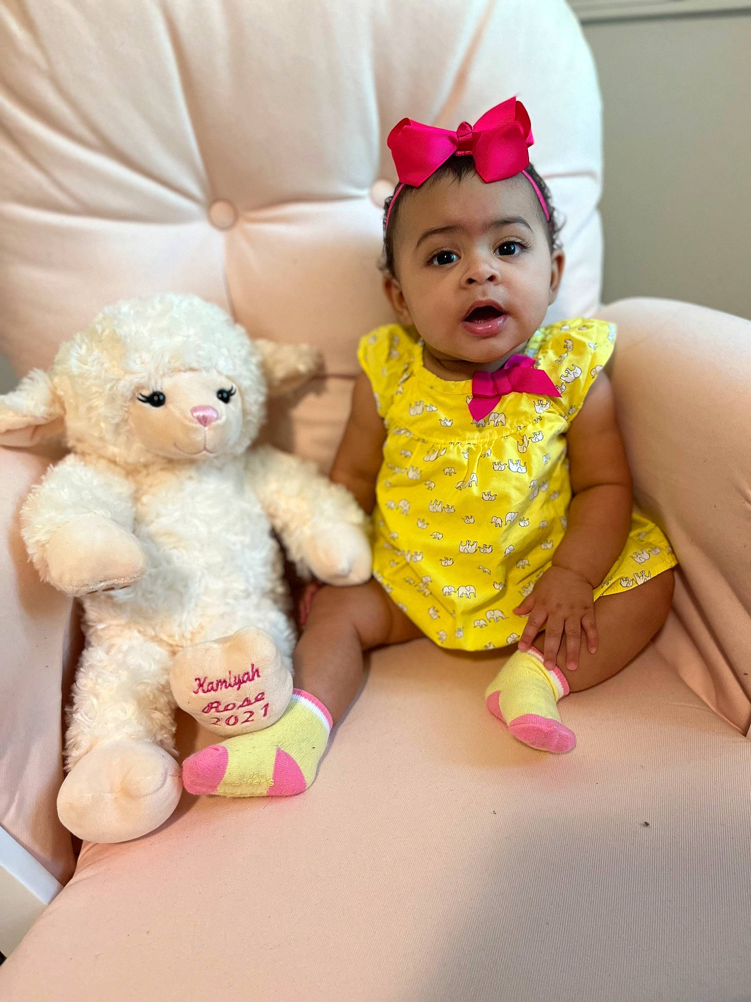 Kamiyah is registered to the contest to win money with this photo: baby, baby_toddler_clothing, cheek, child, dress, finger, happy, headband, magenta, person, pink, purple, red, skin, sleeve, teddy_bear, textile, toddler, toy, white