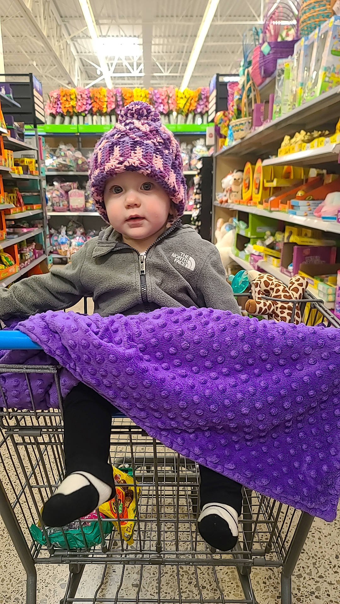 Maddison joined the competition — help win amazing prizes! bag, city, customer, headwear, human_settlement, local_food, market, natural_foods, person, photograph, product, public_space, purple, retail, selling, service, shelf, shopping, snapshot, toddler