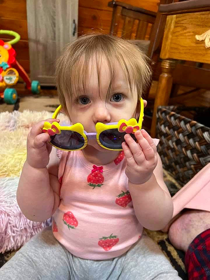 Maddison is registered to the contest to win money with this photo: baby_toddler_clothing, cheek, child, eyewear, facial_expression, finger, fun, glasses, goggles, happy, head, jeans, lip, mouth, nail, nose, person, skin, sunglasses, toddler