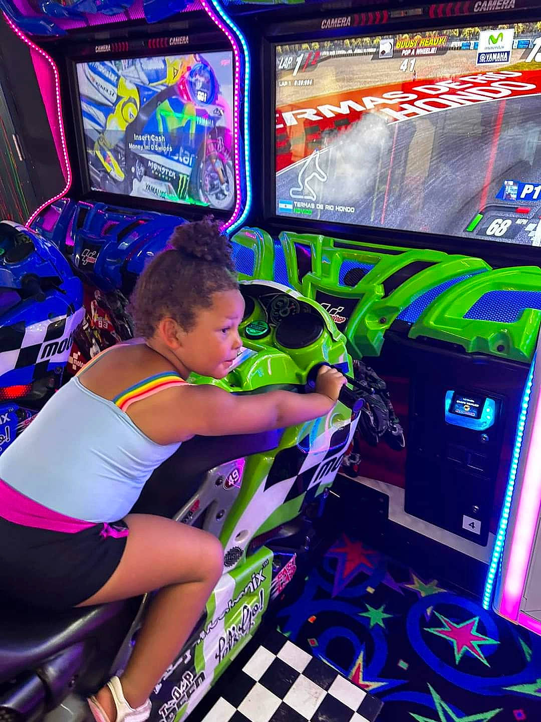 Kaidynce is registered to the contest to win money with this photo: arcade_game, display_device, electric_blue, electronic_device, entertainment, event, fun, gadget, gamer, games, green, human_leg, leg, leisure, machine, person, purple, recreation, technology, thigh