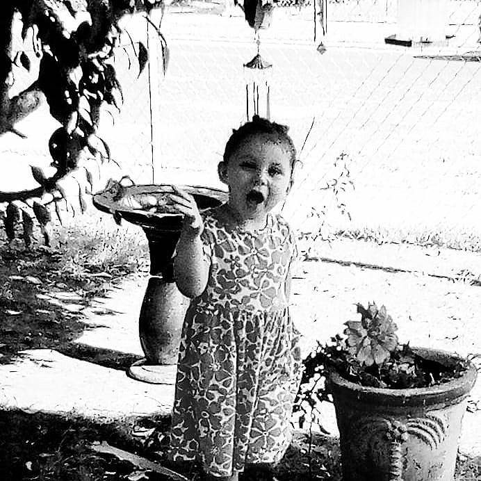 Raelyn is registered to the contest to win money with this photo: black, black_and_white, child, flash_photography, flowerpot, gesture, grass, happy, houseplant, monochrome, monochrome_photography, people_in_nature, person, photograph, plant, snapshot, style, tints_and_shades, tree, water