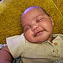 Binyamyin joined the competition — help win amazing prizes! baby, smiling, sleeping, cushion, yellow, ribbed_shirt, blanket, cozy, infant, peaceful, face, portrait, child, soft_lighting, indoor, closeup, happy, cute, skin, relaxed