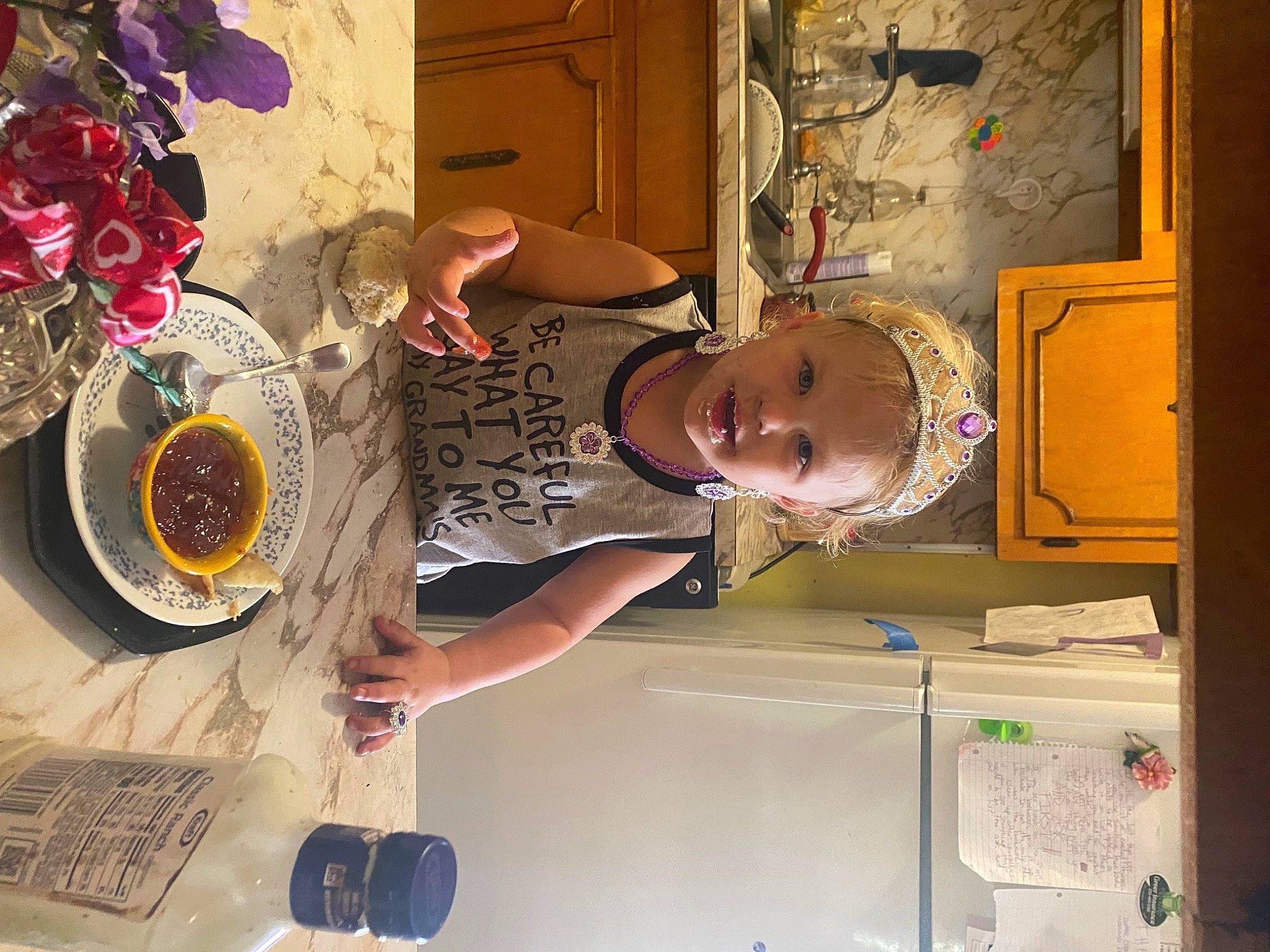 Penny is registered to the contest to win money with this photo: cabinetry, door, flower, fun, hat, kitchen, machine, person, petal, plant, platter, refrigerator, room, rose, shelving, smile, table, tableware, visual_arts, wood