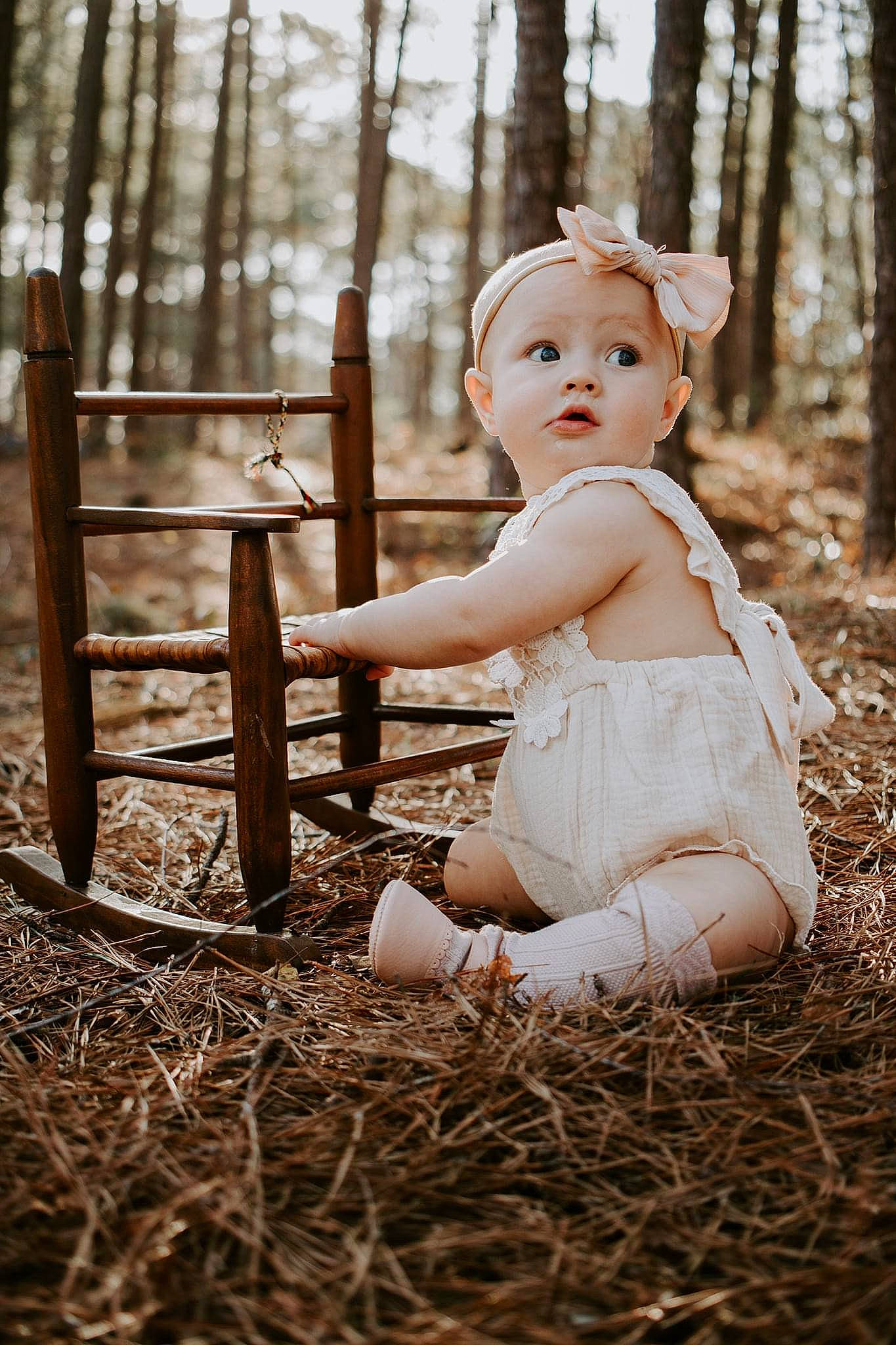Amelia is registered to the contest to win money with this photo: baby, baby_toddler_clothing, blond, child, facial_expression, fawn, flash_photography, forest, fun, grass, hand, happy, leaf, people_in_nature, person, plant, skin, sunlight, surprise, toddler