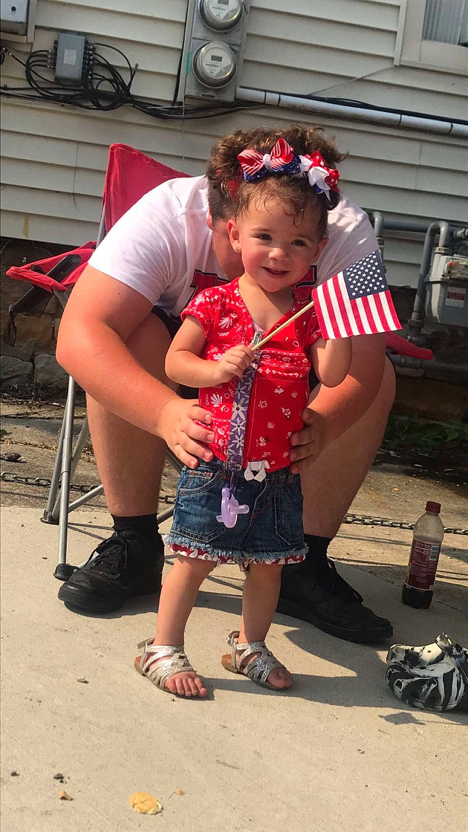 Paizley is registered to the contest to win money with this photo: child, event, face, flip_flops, footwear, fun, hairstyle, happy, joy, leg, leisure, person, pink, sandal, shoe, skin, smile, sneakers, standing, style