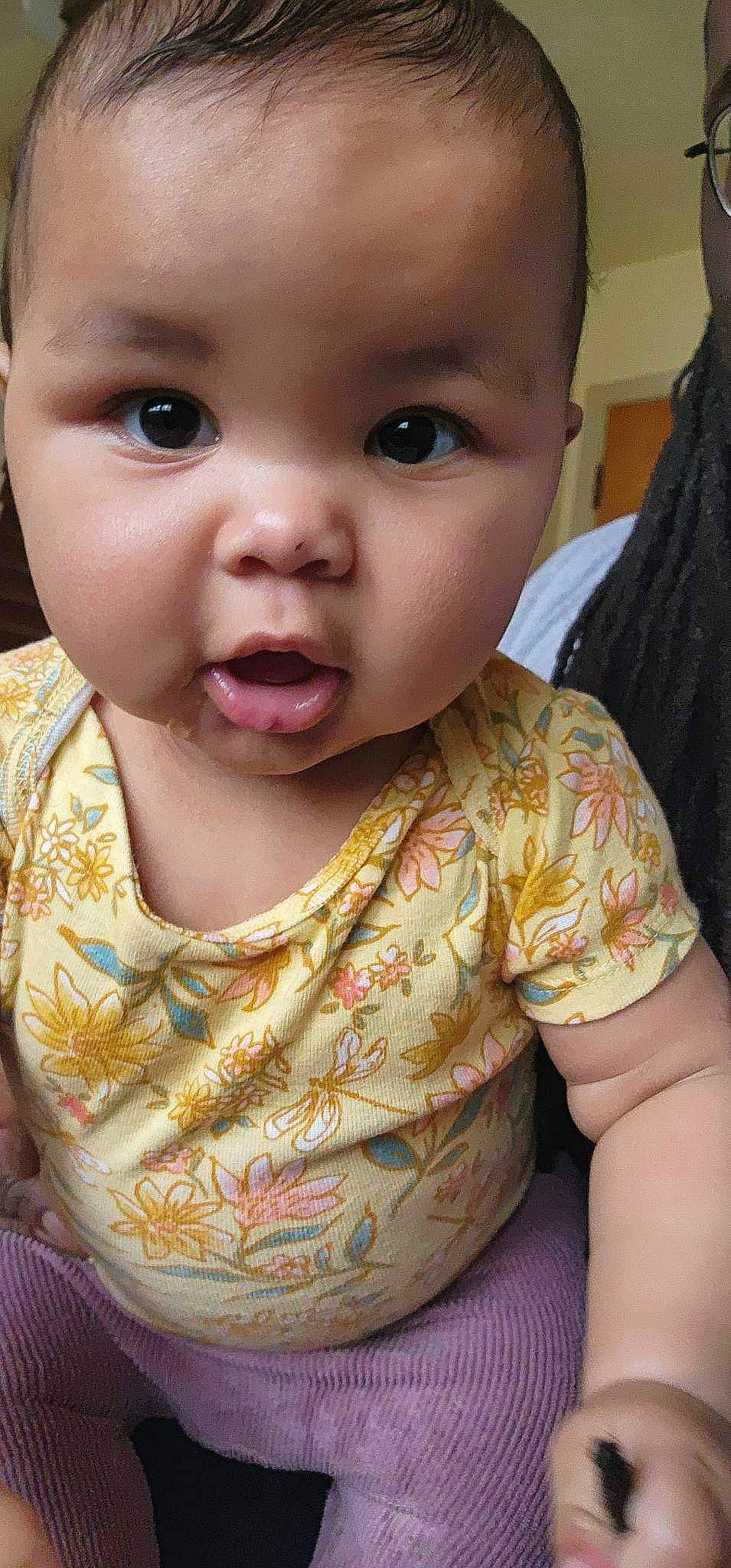 Journey is registered to the contest to win money with this photo: baby, baby_toddler_clothing, cheek, child, chin, dress, ear, eyebrow, eyelash, fun, happy, human_body, iris, lip, mouth, neck, nose, person, skin, sleeve